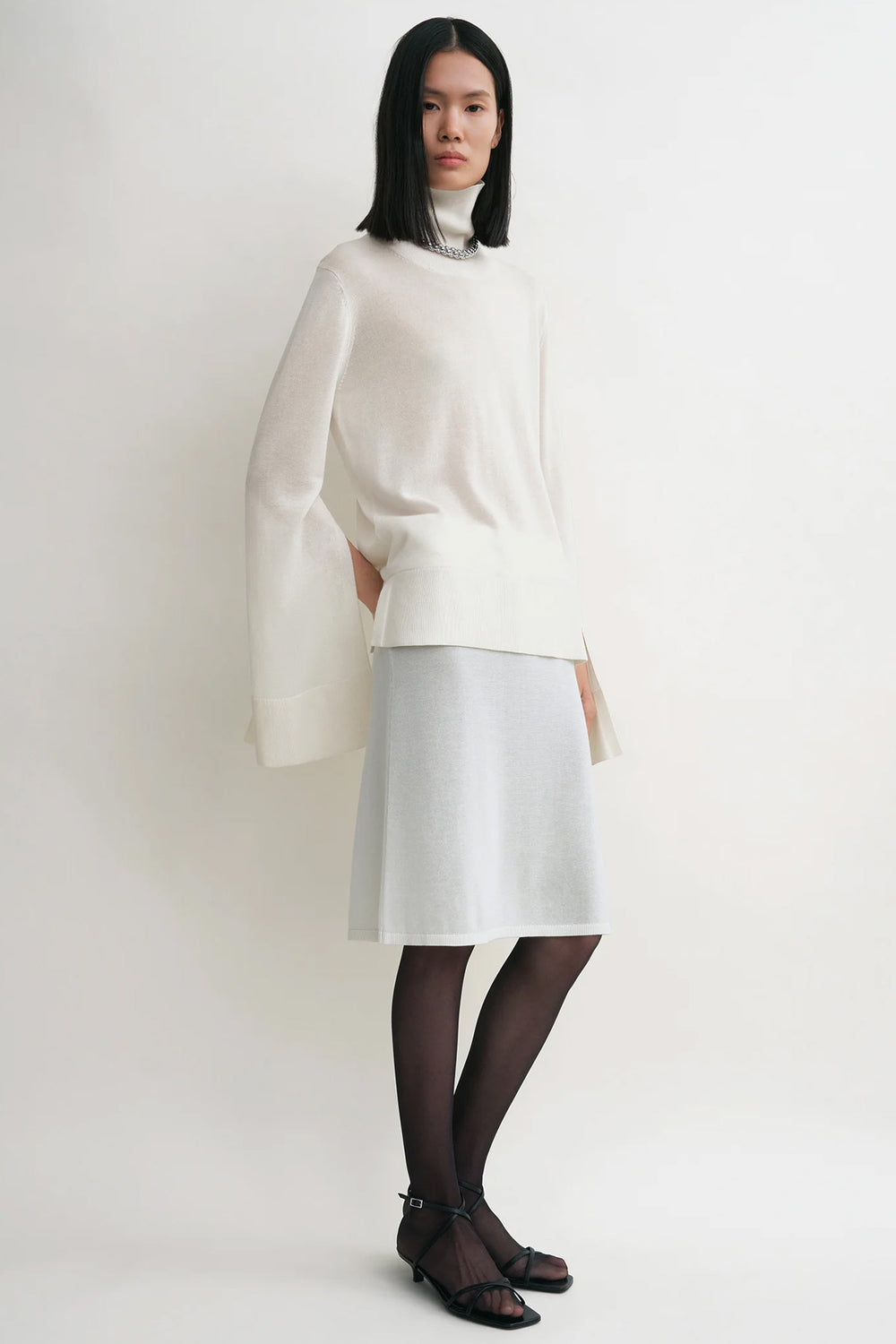 Slit Sleeve Turtleneck